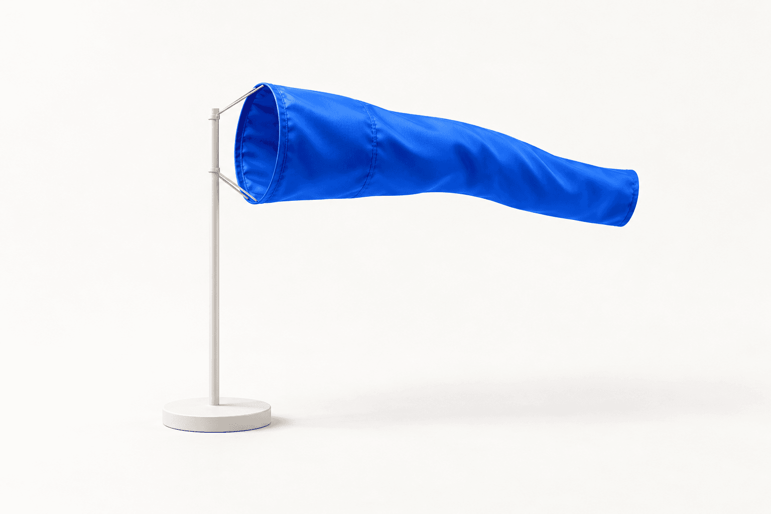 A blue windsock on a white pole, filled by the wind